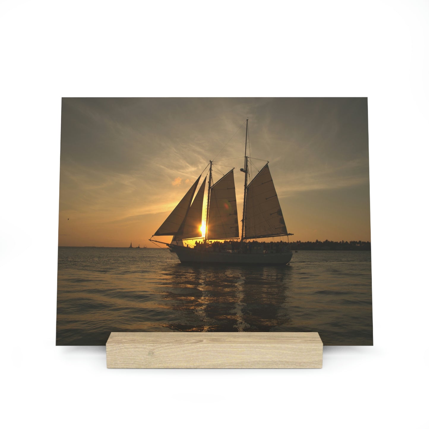 Sailboat Sailing into the Golden Sunset: A Breathtaking Photo Print